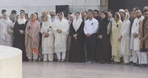 Tareq with family by the grave of his mother 